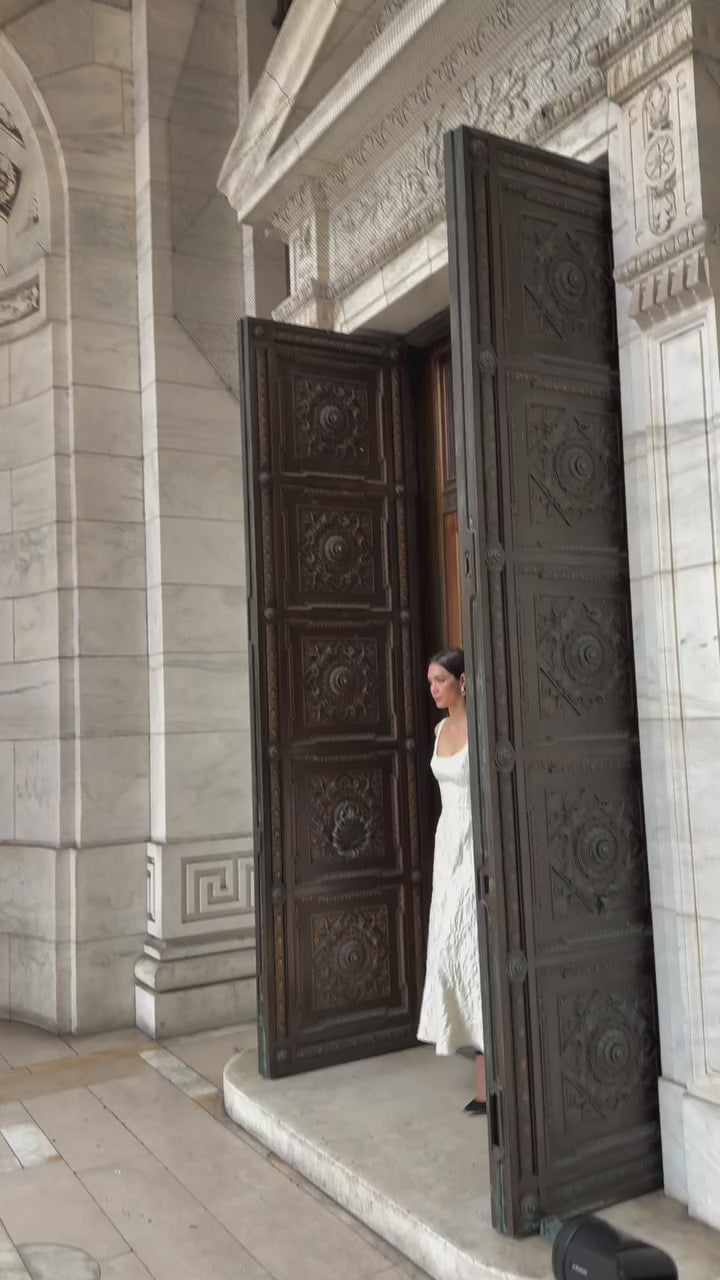 Monique Lhuillier Fall 2025 scoop neck, a-line dress in ivory floral jacquard fabric - Instagram video.