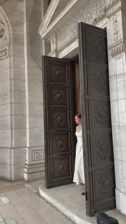 Monique Lhuillier Fall 2025 scoop neck, a-line dress in ivory floral jacquard fabric - Instagram video.