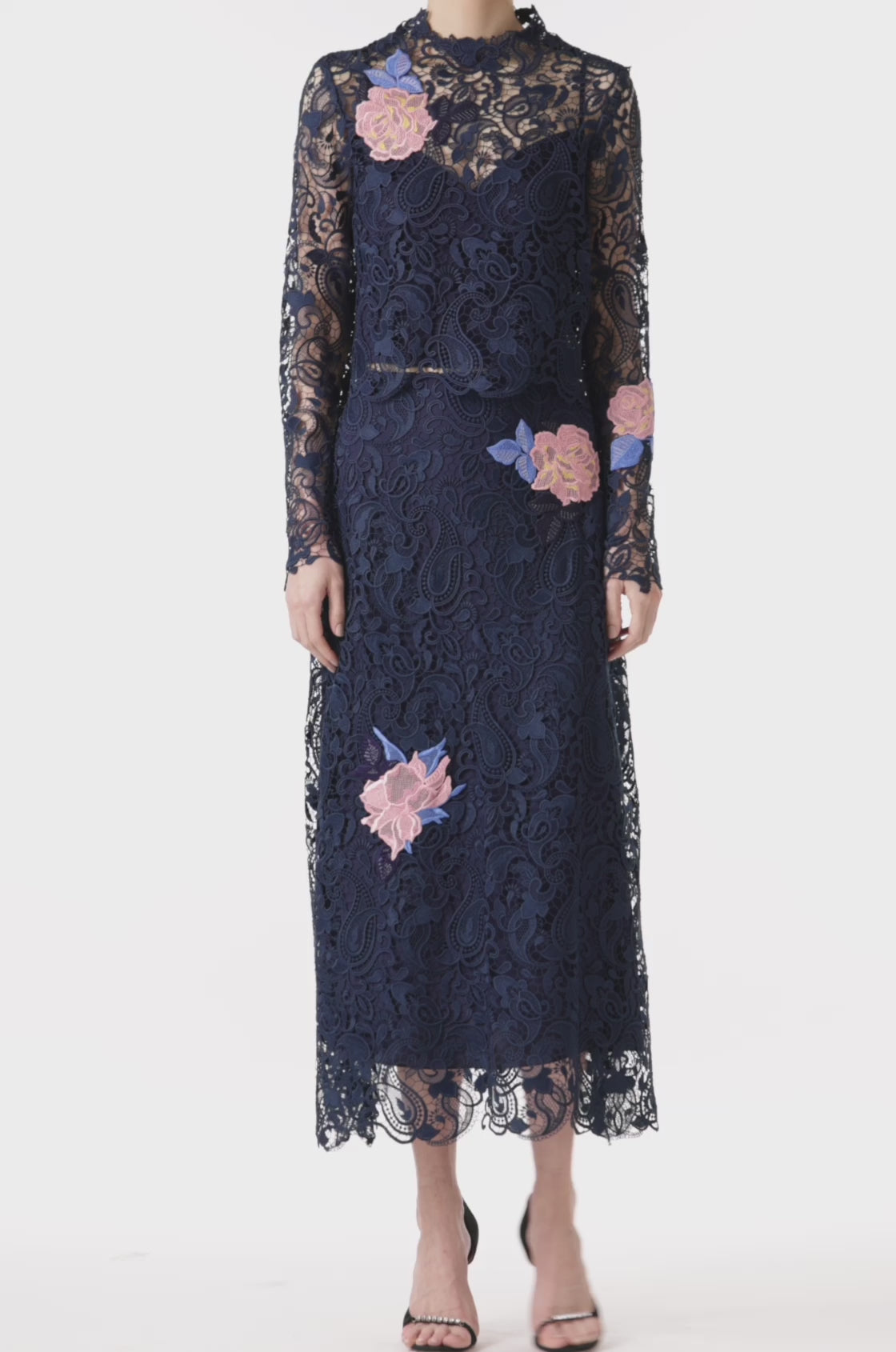 Monique Lhuillier midi-length navy guipure lace skirt with pink lace flowers.