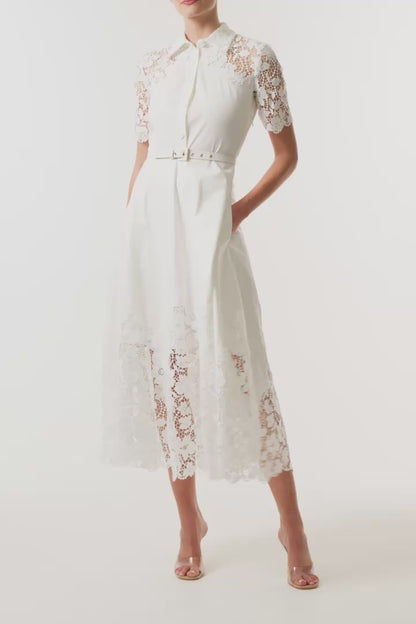 Monique Lhuillier Spring 2025 white cotton poplin dress with lace applique inserts, short sleeves, button down front bodice and belted waist - video.