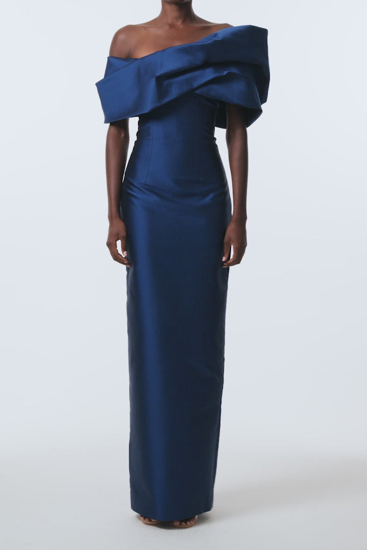Monique Lhuillier Spring 2026 Navy Mikado Asymmetric drape neckline column gown - video.