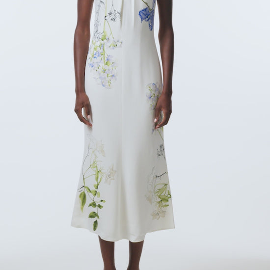 Monique Lhuillier Spring 2026 Ivory/Multi Iris Bouquet Printed Crepe Draped neckline cap sleeve dress - video.