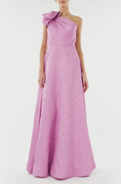 ML Monique Lhuillier floor length dress in orchid jacquard fabric with one shoulder and bow neckline.