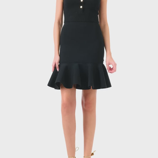 Monique Lhuillier black cashmere cropped tank with scoop neck and gold buttons - video.