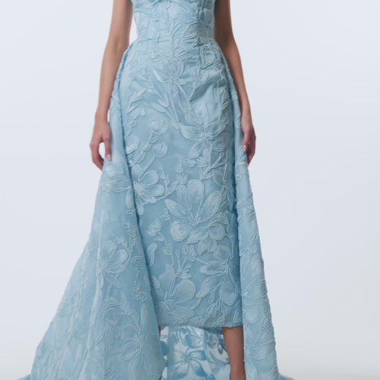 Monique Lhuillier Spring 2026 Plumeria Floral Corded Organza Strapless tea - length column gown with train - video.