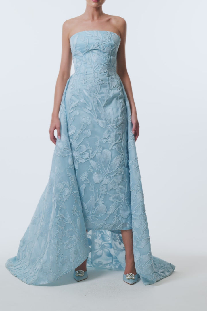 Monique Lhuillier Spring 2026 Plumeria Floral Corded Organza Strapless tea - length column gown with train - video.