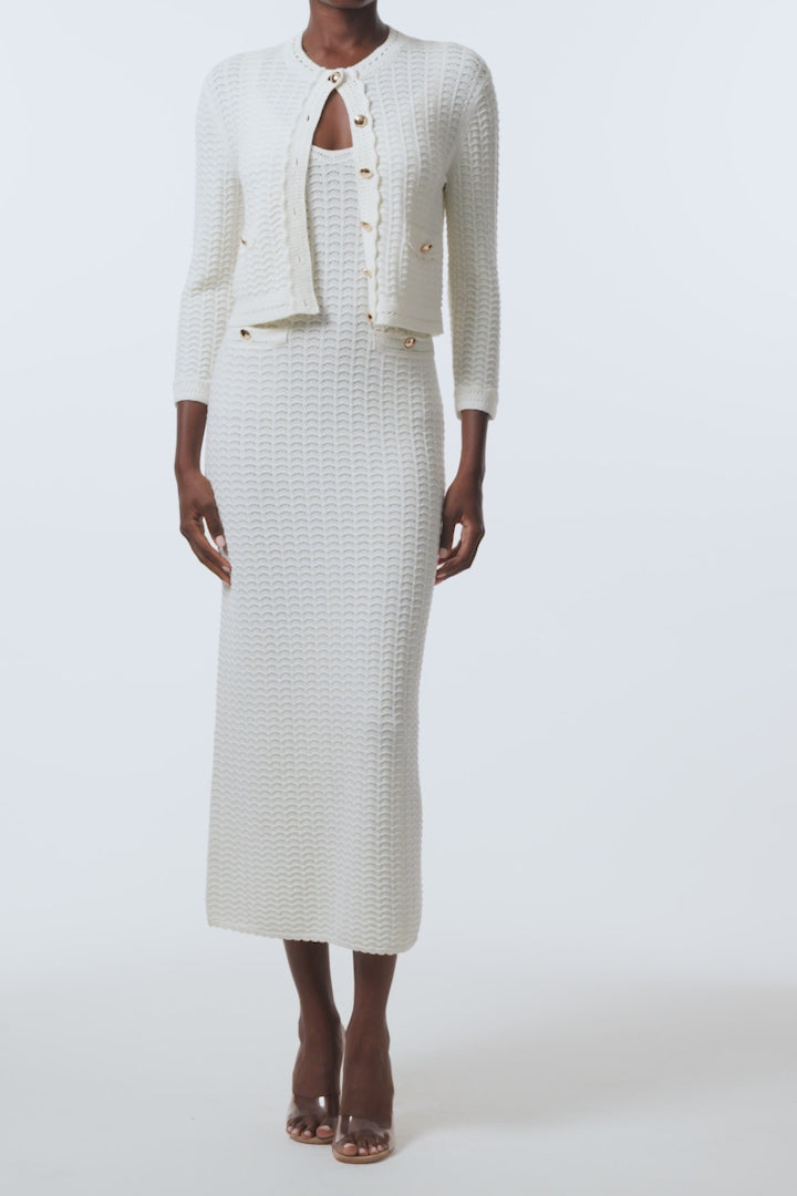 Monique Lhuillier Spring 2026 Ivory Cotton Viscose Knit Lace stitch cardigan with gold buttons with coordinating dress - video.