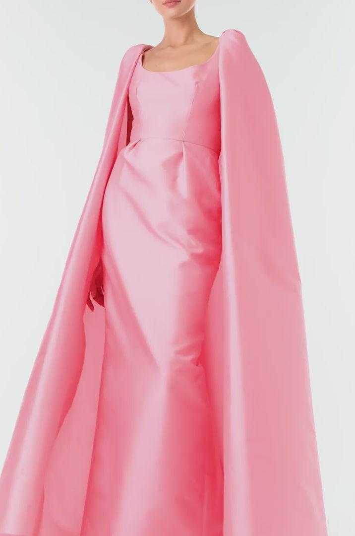 Monique Lhuillier Fall 2024 Dahlia pink mikado, sleeveless column gown with scoop neckline and attached cape - video.