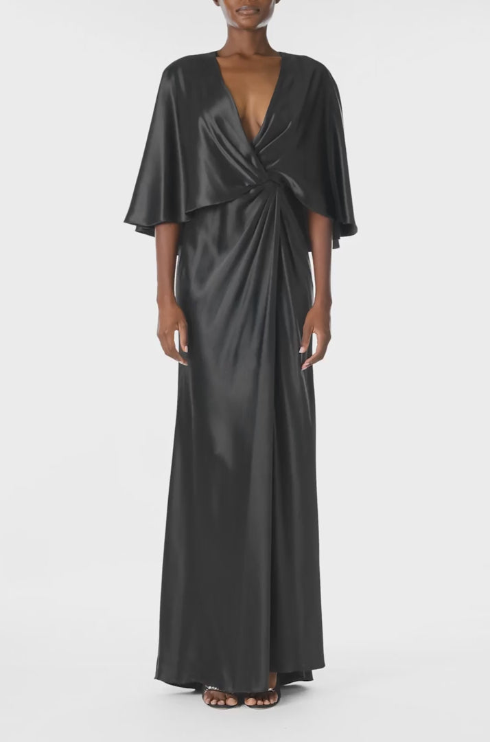 Monique Lhuillier deep V-Neck draped gown with attached capelet and high leg slit in black crepe back satin - video.