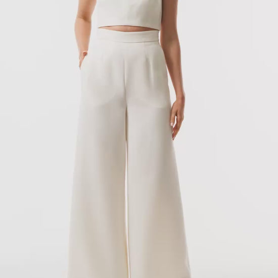 Monique Lhuillier Spring 2025 wide leg palazzo trouser in silk white wool suiting - video.