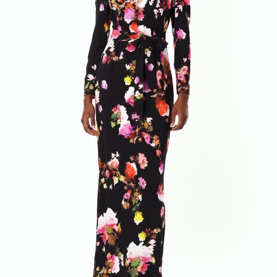 Monique Lhuillier Spring 2024 long sleeve, jewel neck floral print gown with self-tie belt at waist. - video.