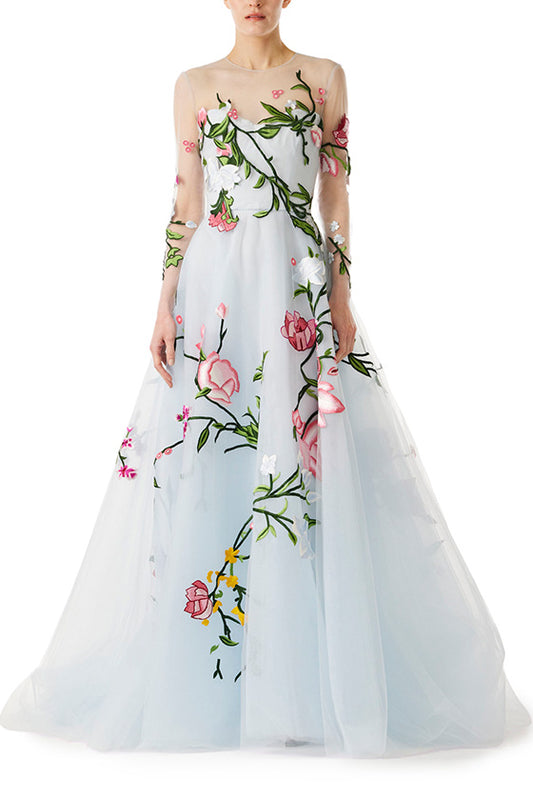 Pale blue tulle evening gown with floral embroidery and illusion sleeves.