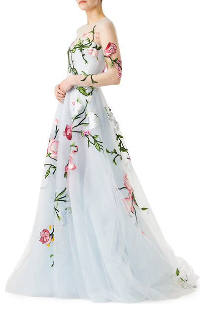 Pale blue tulle evening gown with floral embroidery and illusion sleeves.