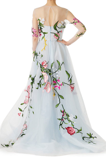 Pale blue tulle evening gown with floral embroidery and illusion sleeves.