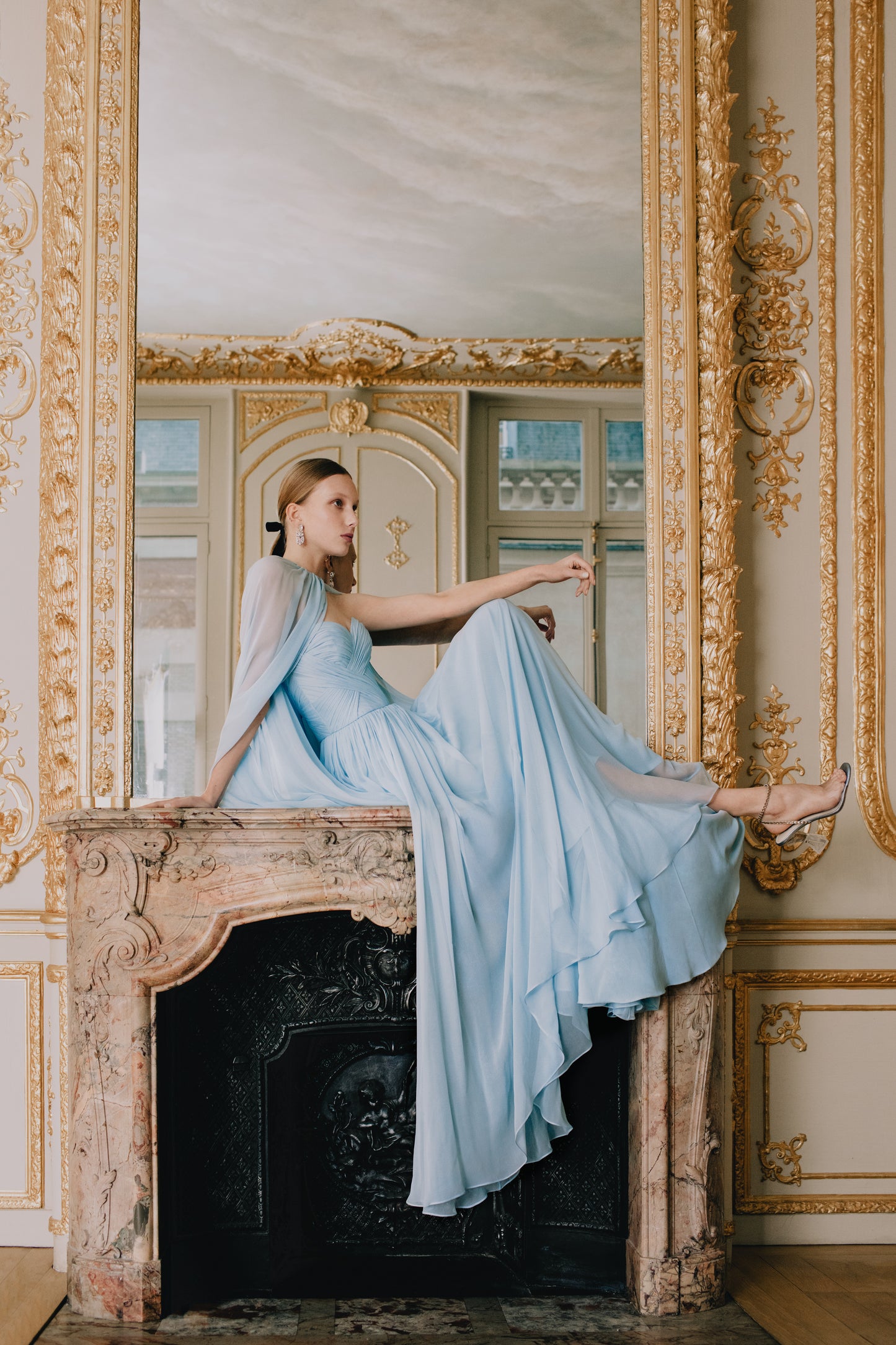 Monique Lhuillier pale blue chiffon gown and sheer cape look book photo.